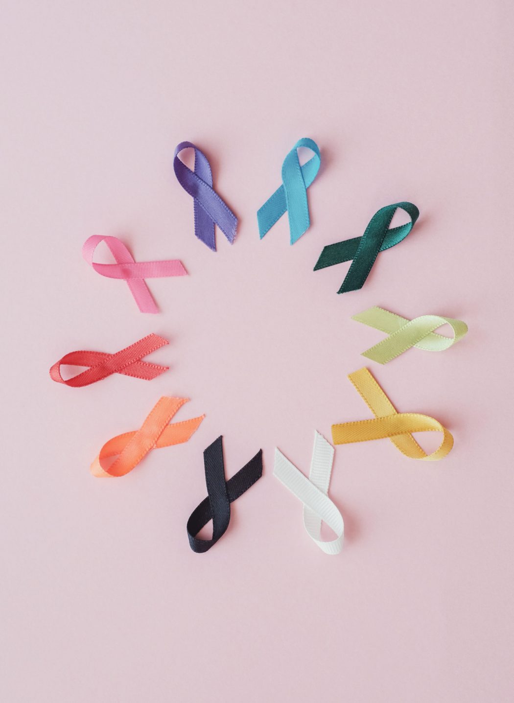 colorful ribbons on pink background, cancer awareness, World cancer day, National cancer survivor day, world autism awareness day
